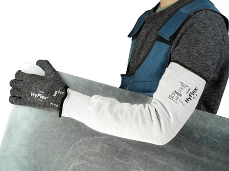 a construction worker wearing cut resistant gloves and sleeves from Ansell brand
